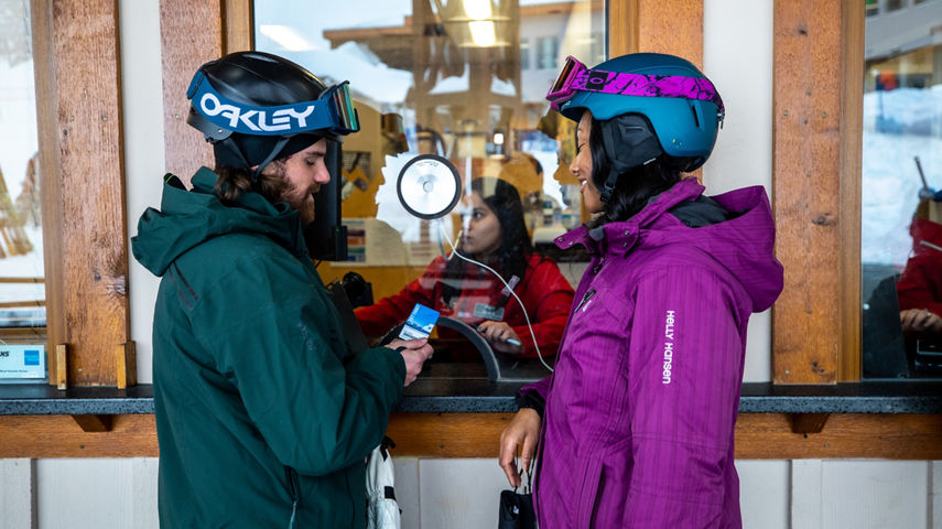 Resort Guests Stand at Stevens Pass Ticket Office Window