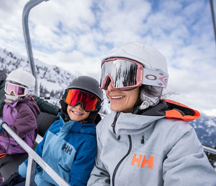 Family Rides 5-Person Chairlift at Whistler Blackcomb