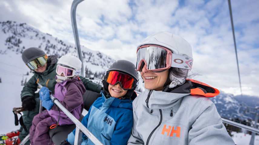 Family Rides 5-Person Chairlift at Whistler Blackcomb