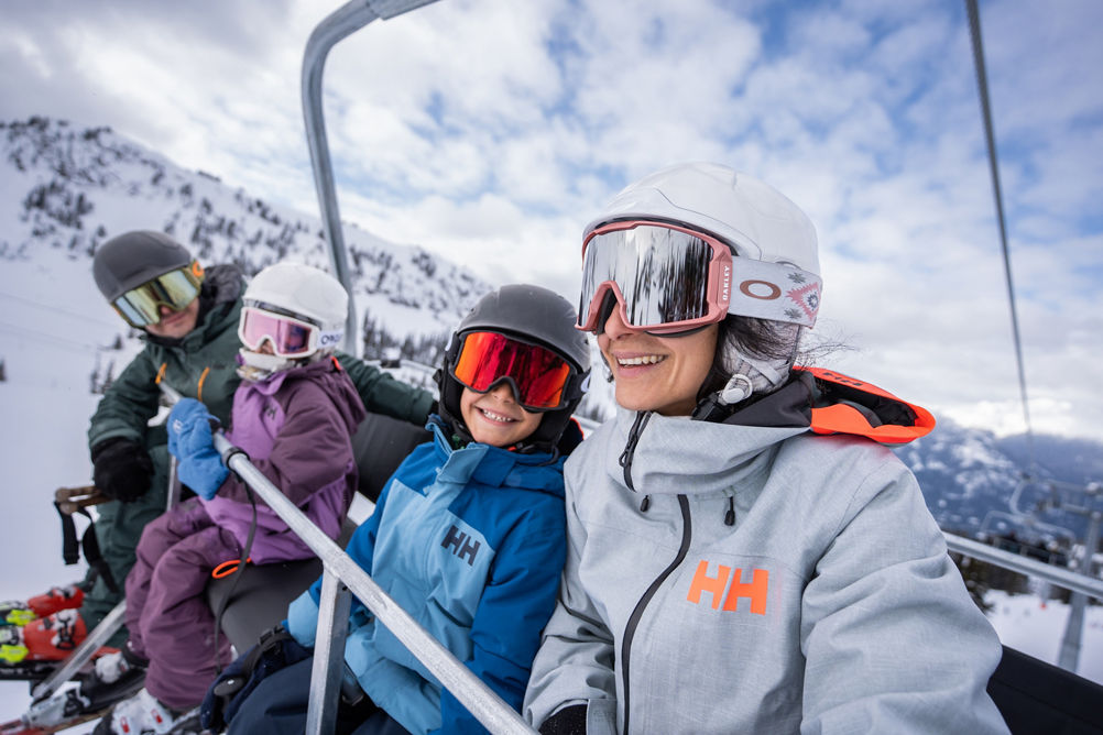Family Rides 5-Person Chairlift at Whistler Blackcomb