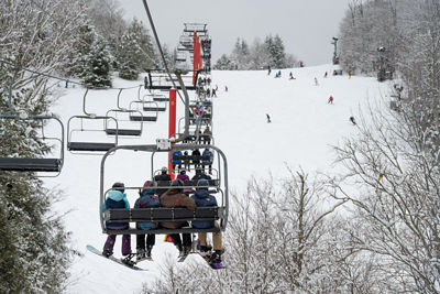 Guests Ride Hunter Express Chairlift