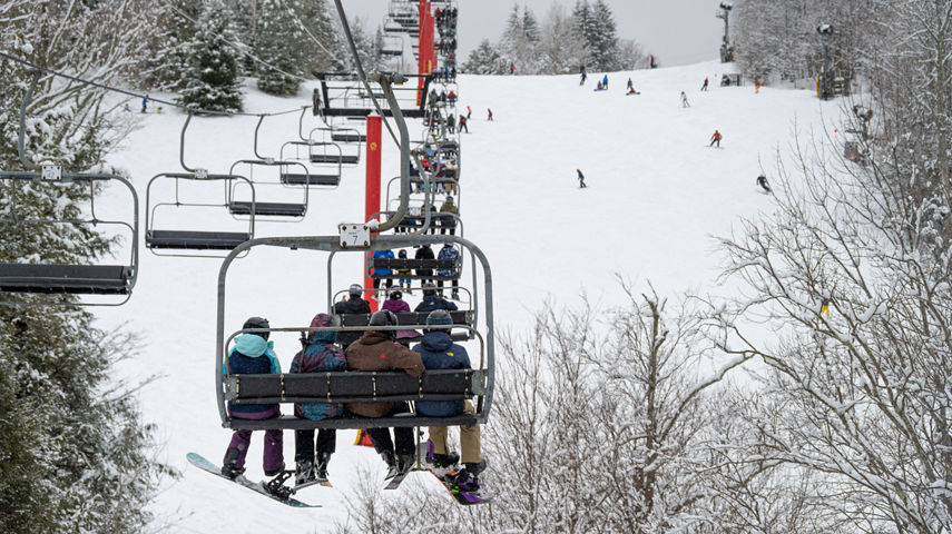 Guests Ride Hunter Express Chairlift