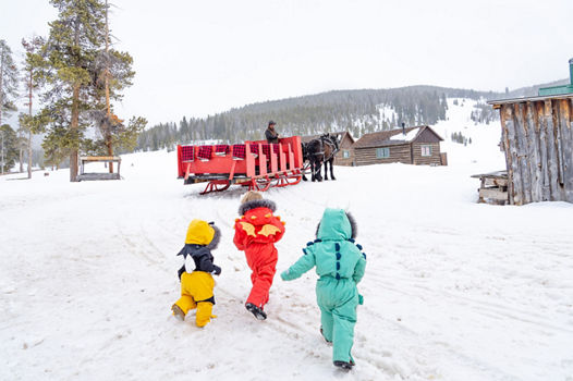 Young Kids Run Towards Sleigh Ride at Keystone Resort