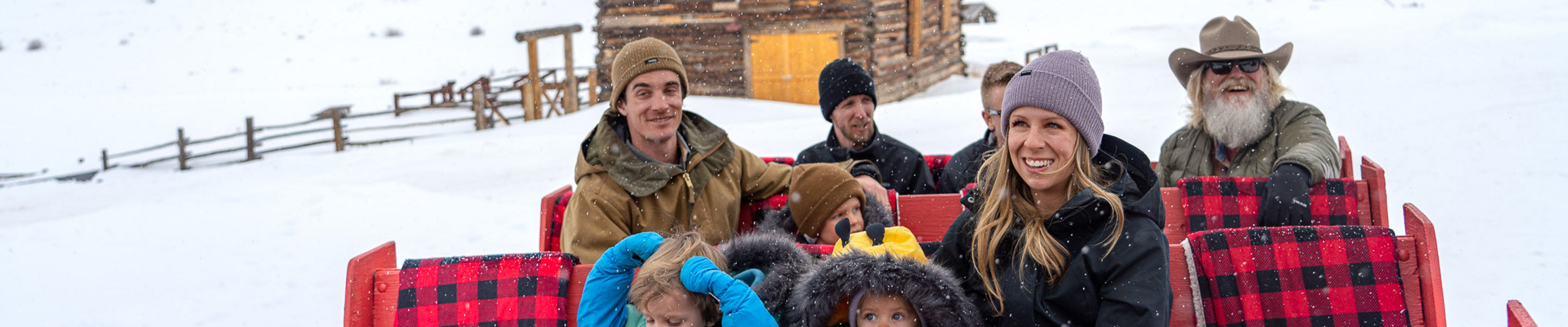Family Enjoying Sleigh Ride through Keystone Resort