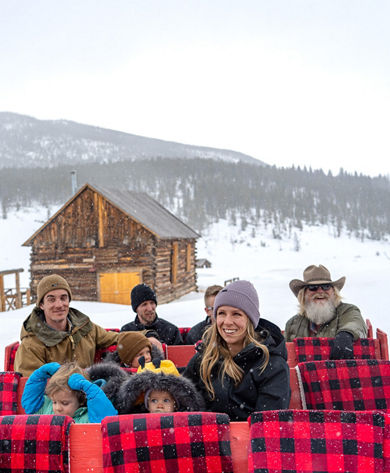 Family Enjoying Sleigh Ride through Keystone Resort