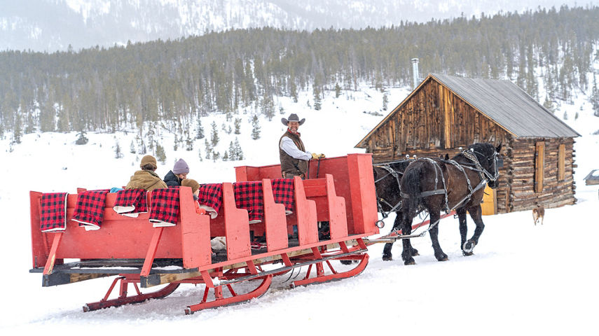 Family Enjoying Sleigh Ride through Keystone Resort
