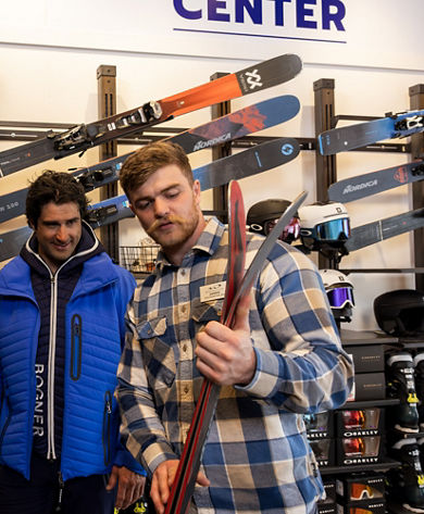 Epic Mountain Rentals Center Employee Assists Guest with Selecting Skis at Whistler Blackcomb