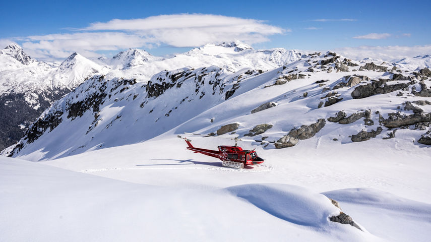 Skiers and Snowboarders Drop Into Deep Powder During a Helliskiing Adventure at Whistler Blackcomb
