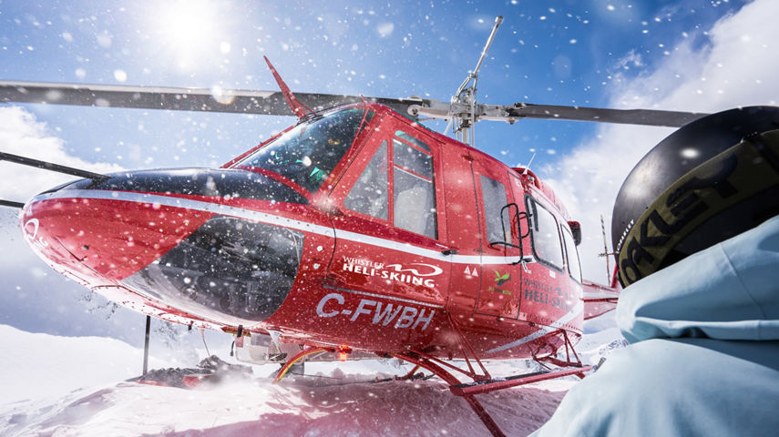 Skiers and Snowboarders Drop Into Deep Powder During a Helliskiing Adventure at Whistler Blackcomb