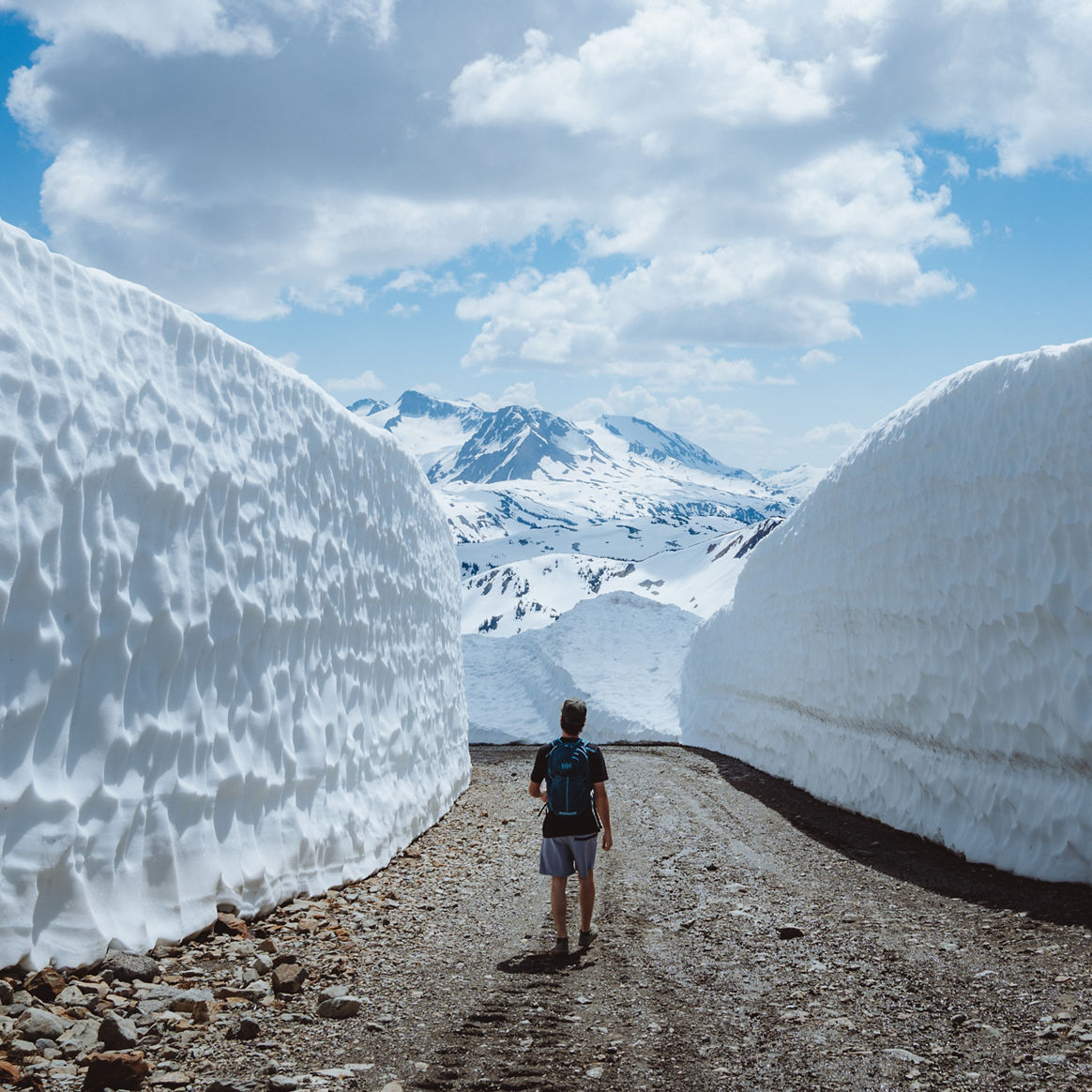 Man Experiences Unique Hiking Adventure Between Giant Snow Walls in Whistler Blackcomb Alpine