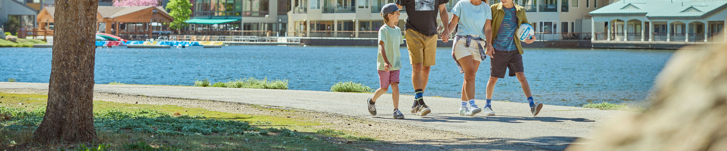 Family Walking Around Lakeside Village at Keystone on a Summer Day
