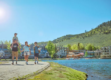 Family Walking Around Lakeside Village at Keystone on a Summer Day