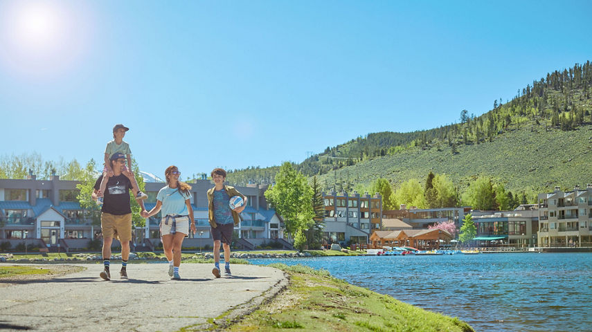Family Walking Around Lakeside Village at Keystone on a Summer Day