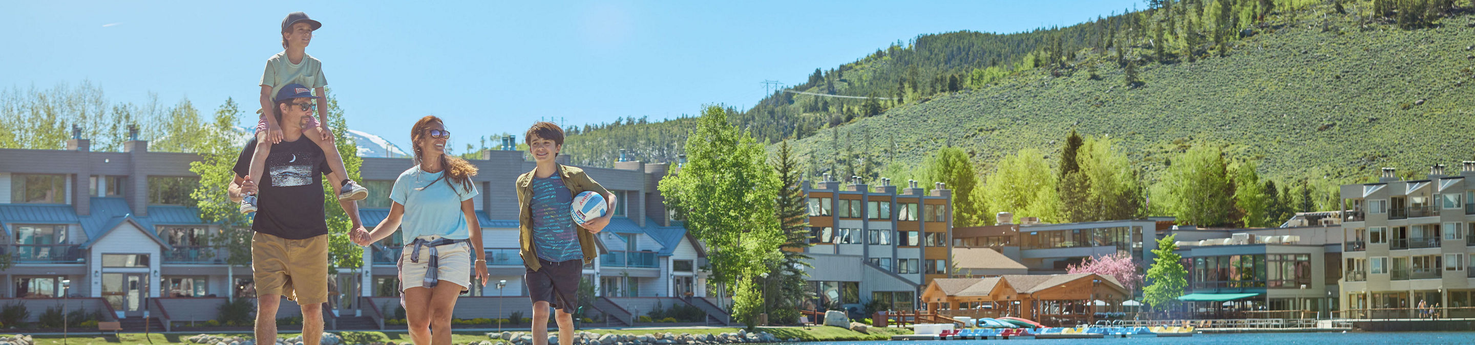 Family Walking Around Lakeside Village at Keystone on a Summer Day