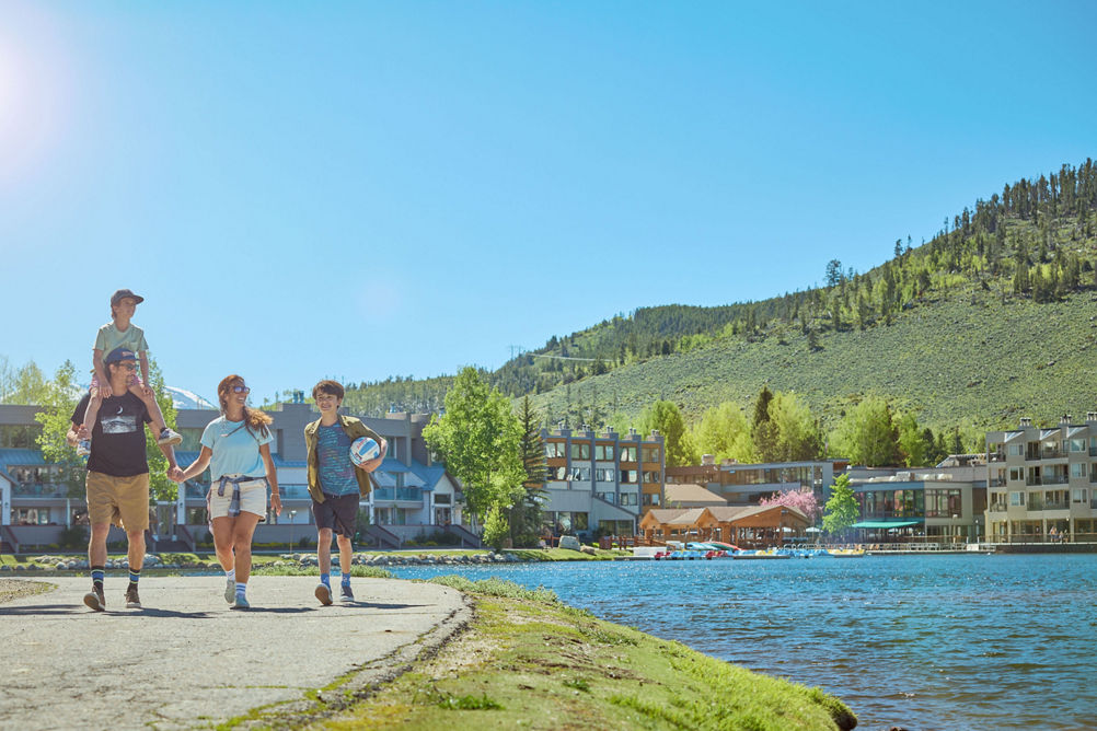 Family Walking Around Lakeside Village at Keystone on a Summer Day