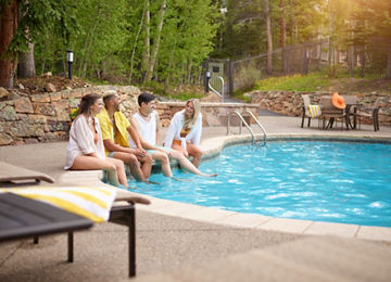 Group of Friends Enjoy the Summer Sun at Mountain Thunder Lodge Pool at Breckenridge