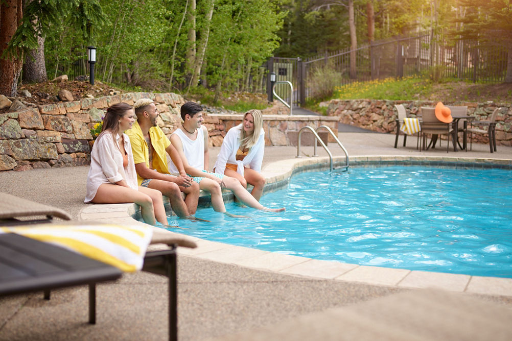 Group of Friends Enjoy the Summer Sun at Mountain Thunder Lodge Pool at Breckenridge