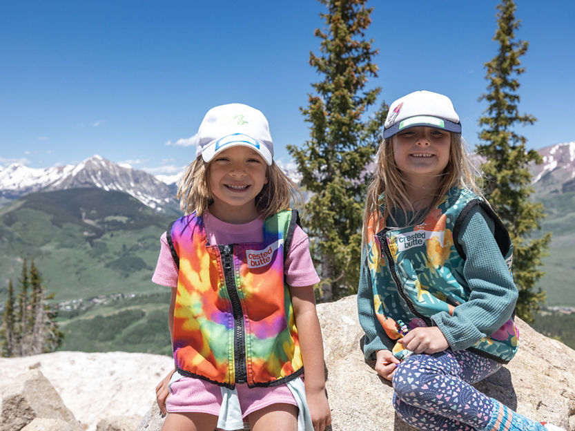 Two Girls Smiling with Mountain in the Background at Crested Butte Summer Camp 2023