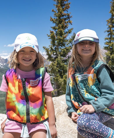 Two Girls Smiling with Mountain in the Background at Crested Butte Summer Camp 2023