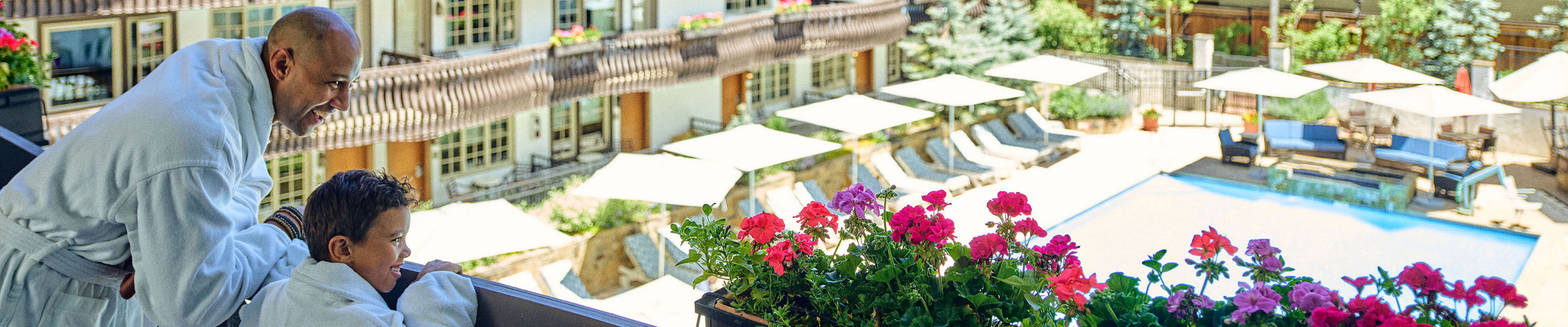 Father and Son Overlooking Vail on the Lodge at Vail Balcony
