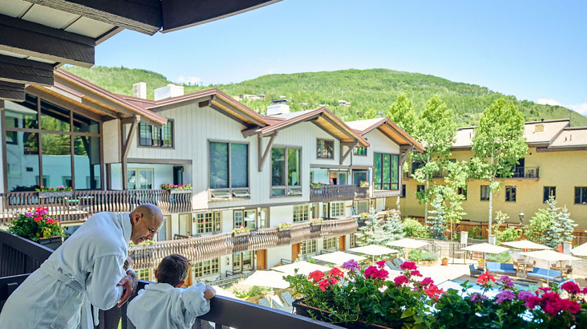 Father and Son Overlooking Vail on the Lodge at Vail Balcony