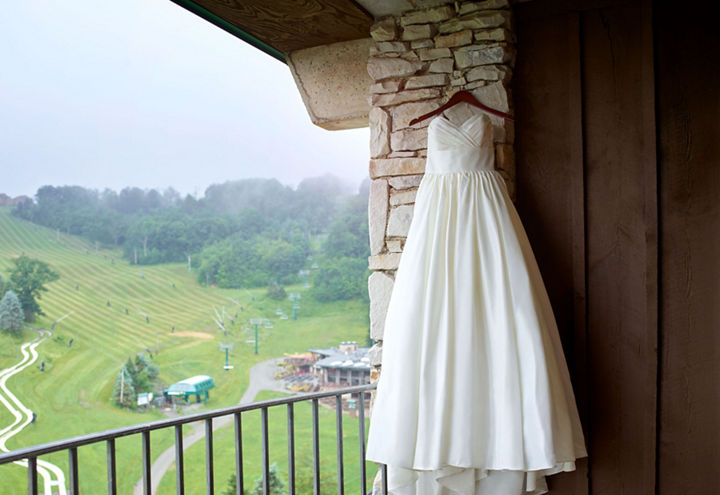 Scenic Shot of Wedding Gown Hanging on Balcony at Seven Springs