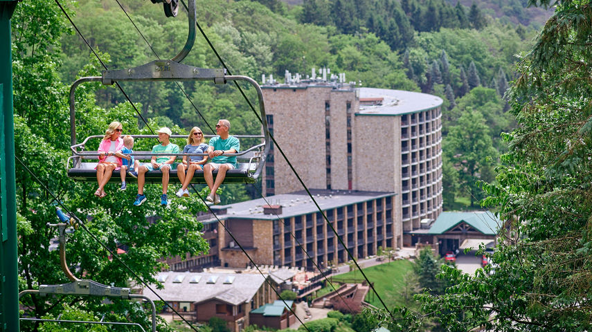 Family Riding Chairlift on a Summer Day at Seven Springs