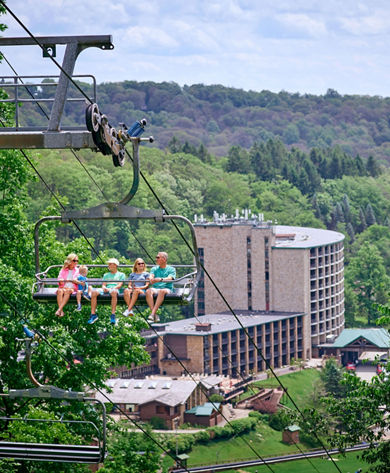 Family Riding Chairlift on a Summer Day at Seven Springs