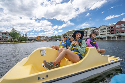 Family of Four Has Fun in Paddleboat at Keystone Lakeside Village