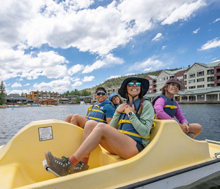 Family of Four Has Fun in Paddleboat at Keystone Lakeside Village