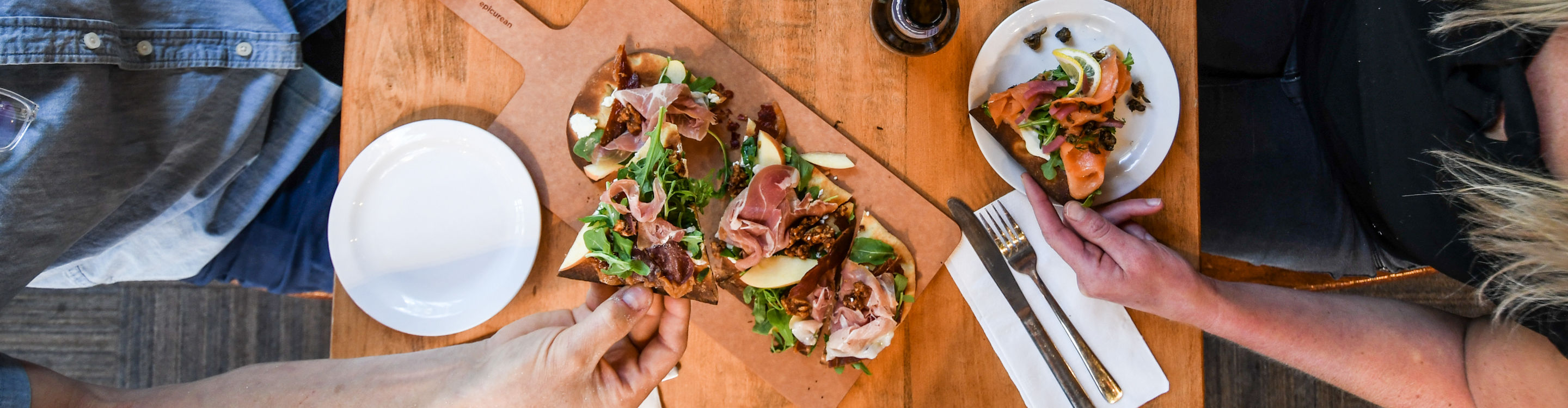 Resort Guests Enjoy Flatbread Pizza and Beers at Merlin's Bar & Grill at Whistler Blackcomb