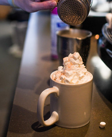 Barista Preparing a Customer's Order at Rendezvous Cappuccino Bar at Whistler Blackcomb