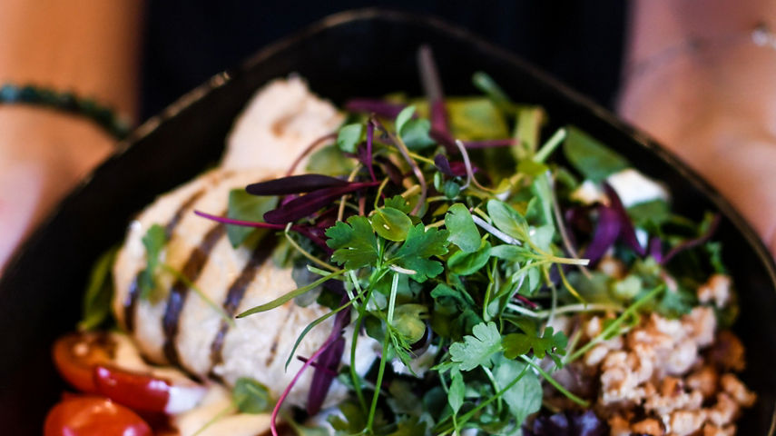 Employee Serves Dish at Roundhouse Lodge at Whistlet Blackcomb