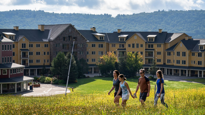 Family Hiking Outside a Jackson Gore Lodge at Okemo During Summer