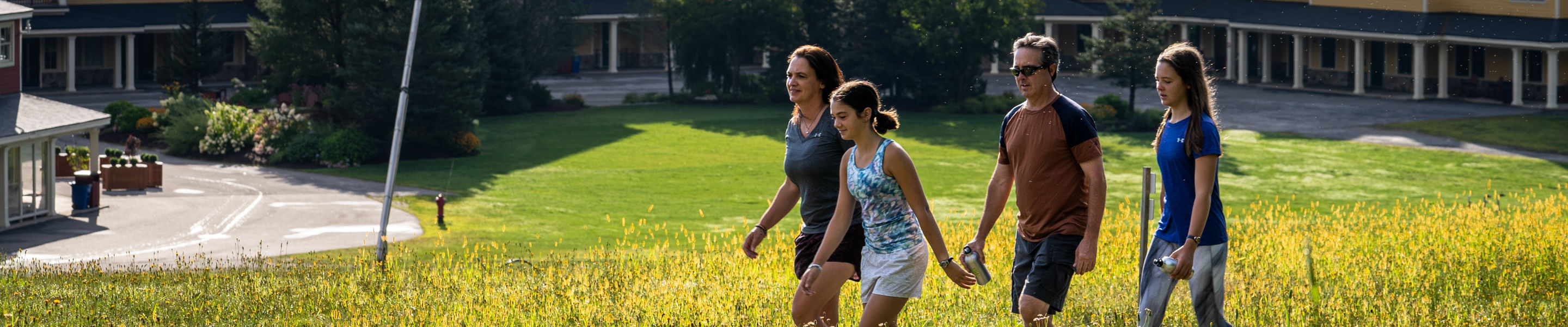 Family Hiking Outside a Jackson Gore Lodge at Okemo During Summer