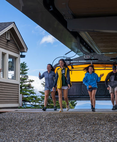 Family Exiting Chairlift Ride at Okemo During Summer