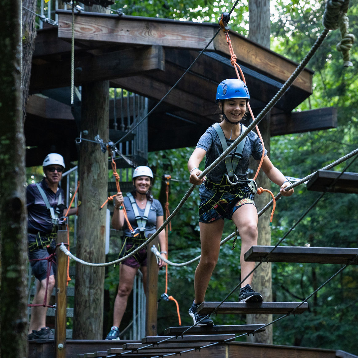 Family Exploring Adventure Park at Okemo During Summer