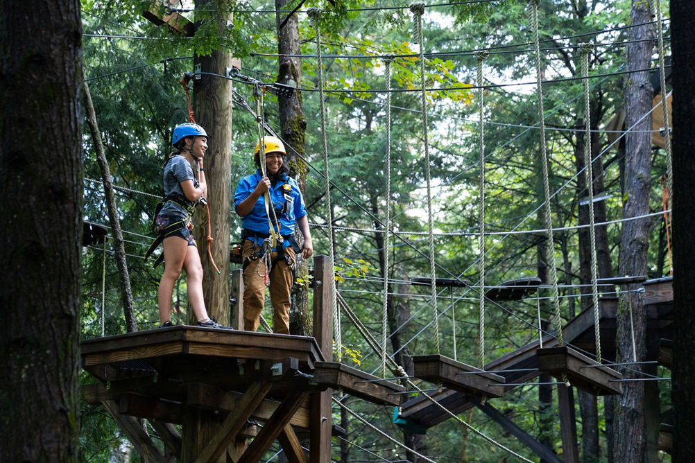 Adolescent Girl Explores Adventure Park at Okemo During Summer