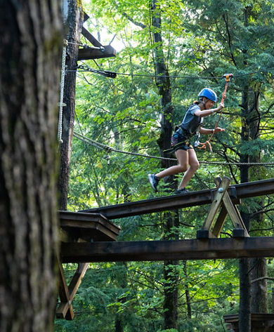 Family Exploring Adventure Park at Okemo During Summer