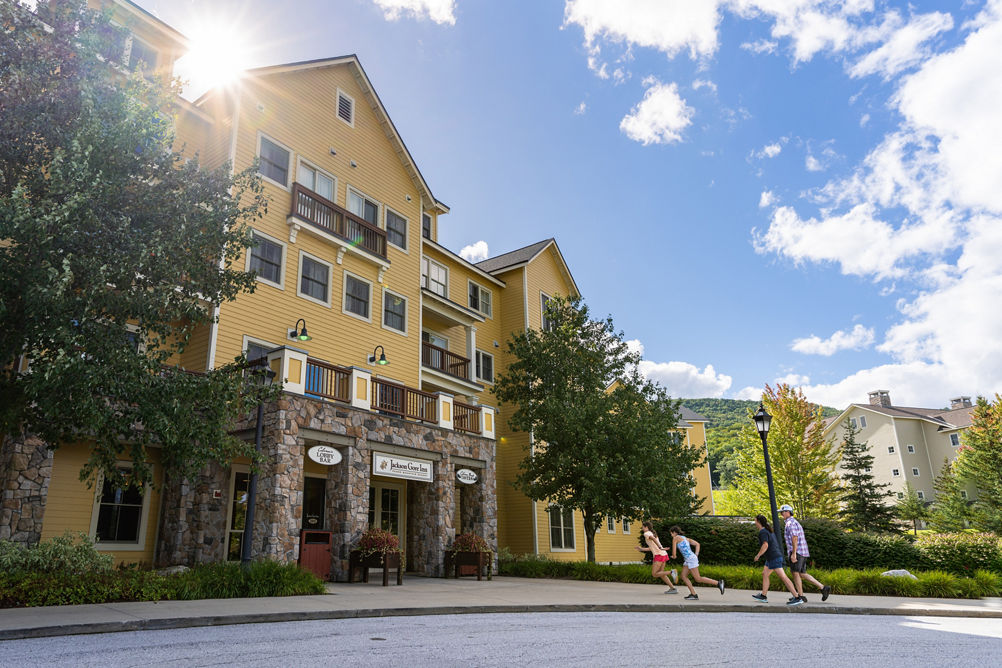 Family Races Towards Jackson Gore Inn at Okemo During Summer