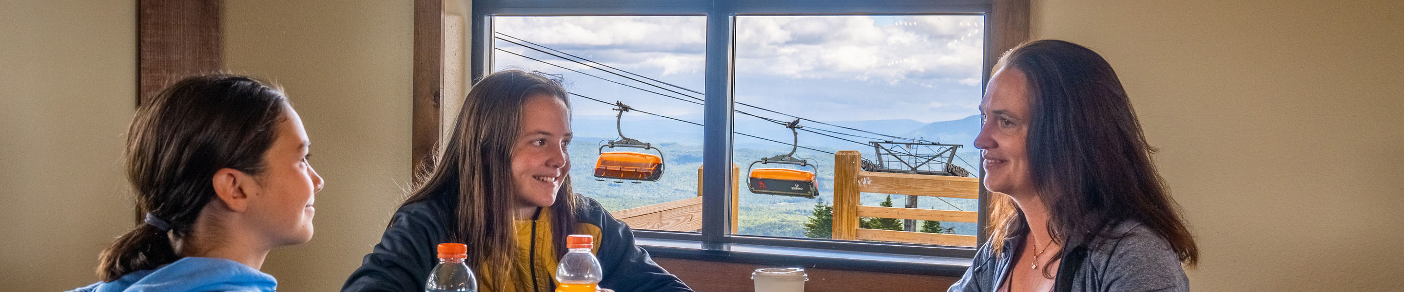 Family Enjoys Lunch at Summit Lodge at Okemo During Summer