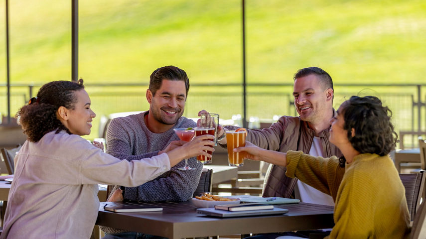 Friends Enjoy Drinks after Working Session at Red Tail Grill Patio at Park City