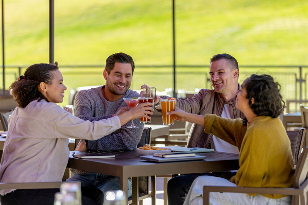 Friends Enjoy Drinks after Working Session at Red Tail Grill Patio at Park City