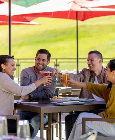 Friends Enjoy Drinks after Working Session at Red Tail Grill Patio at Park City