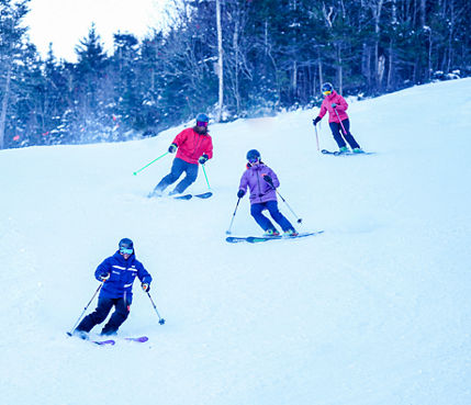 Ski Instructor Guiding Adults at Wildcat