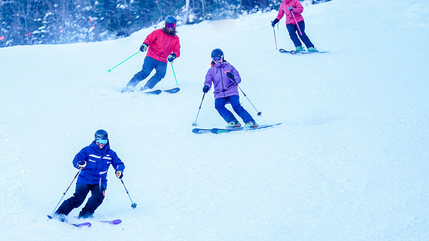 Ski Instructor Guiding Adults at Wildcat