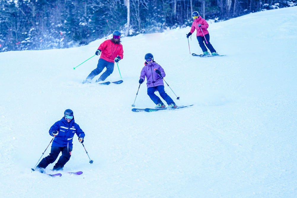 Ski Instructor Guiding Adults at Wildcat