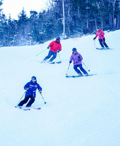 Ski Instructor Guiding Adults at Wildcat