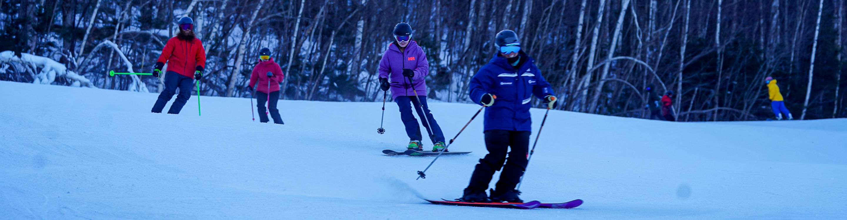 Ski Instructor Guiding Adults at Wildcat