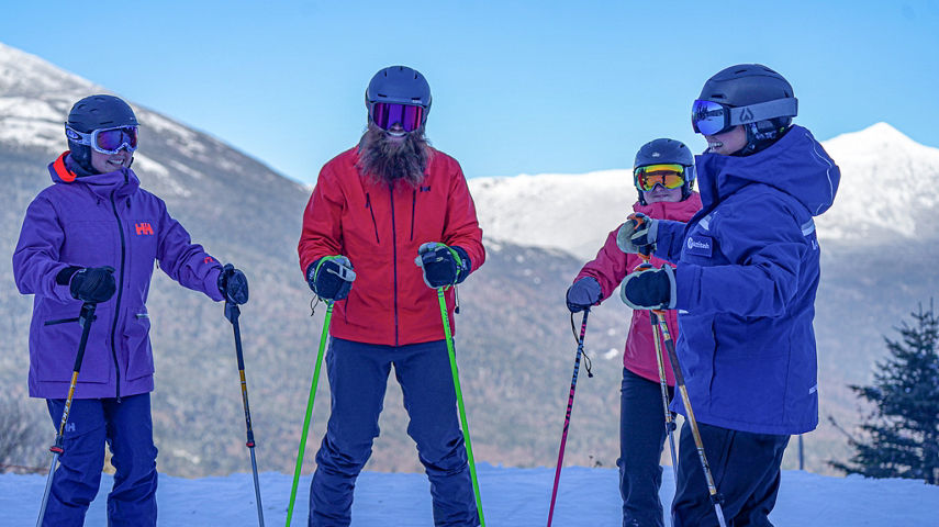 Ski Instructor Guiding Adults at Wildcat